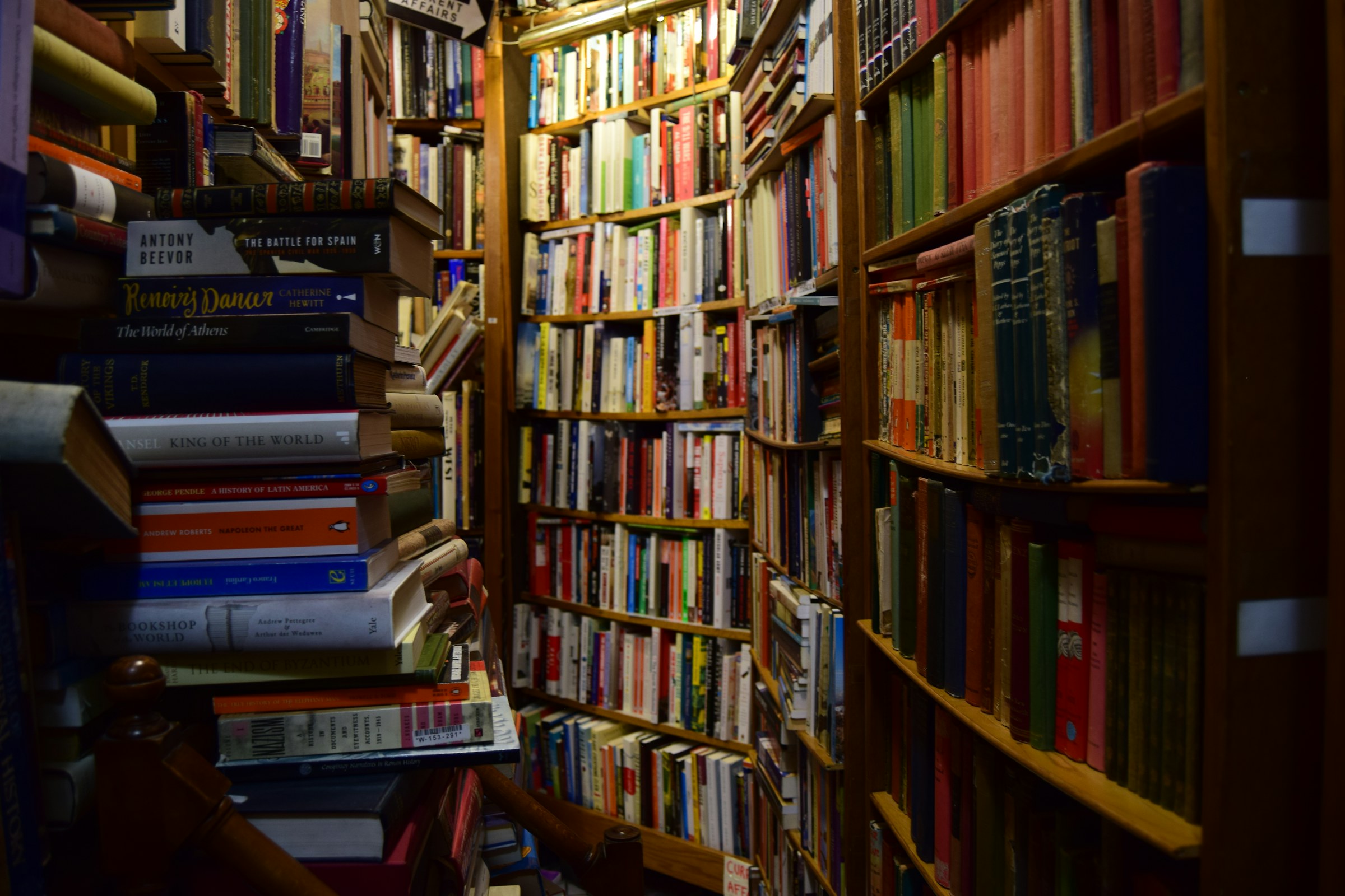 Old law books on a wooden shelf